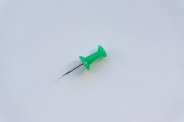 istock Green office button for attaching papers to the wall 1081222614