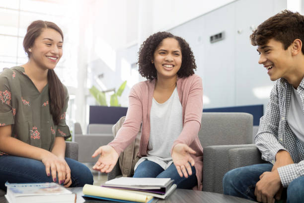istock Group of students enjoy studying together in school lobby 1081225384