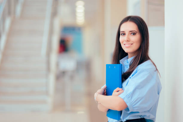 istock Professional Woman Holding Folder in Office Building 1081247190