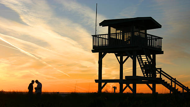 Lifeguard tower, art deco design, Clearwater Beach, Florida, early October morning, Gulf of Mexico in the background, pastel looking colors.