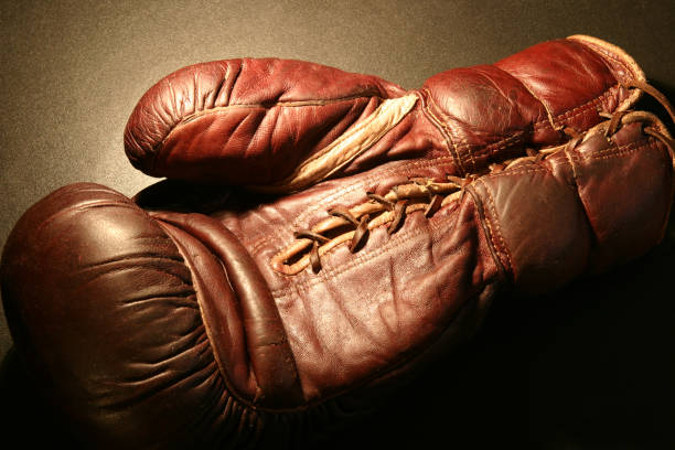 istock Vintage Red Boxing Glove Under Light 108125147