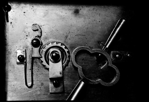 Old vintage keys and padlock on a rusty grunge metal background. Escape room game, winning banner.