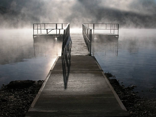 istock walkway leading to a dock within fog 108125601