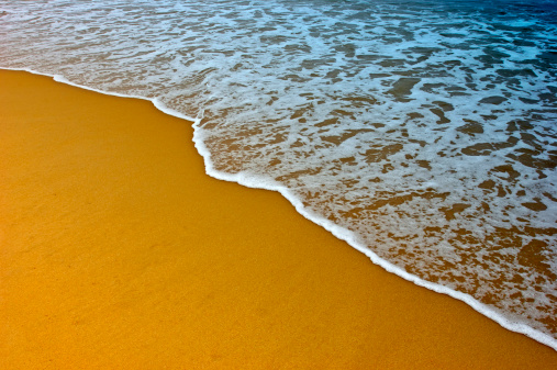 Empty chair on the surf line.