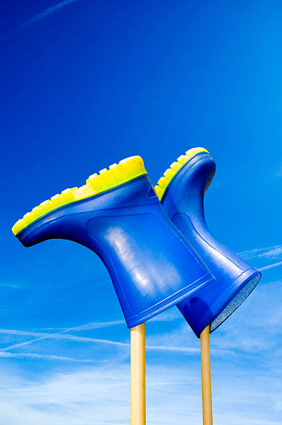 Rubber Shoes on Sticks in Air stock photo