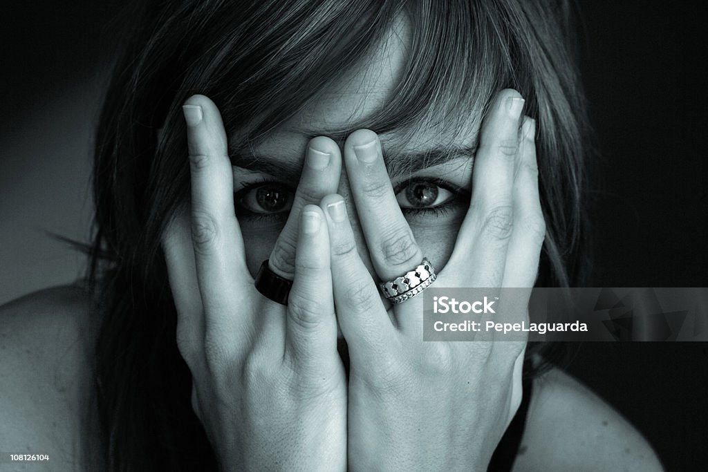 Portrait of Young Woman Hiding Face in Hands, Toned  Mystery Stock Photo