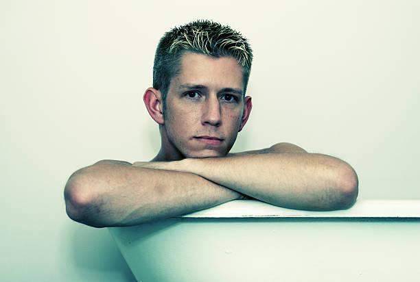 istock Young Man Sitting in Tub 108126119