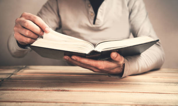 istock Caucasian man reading a book. Education concept 1081261574