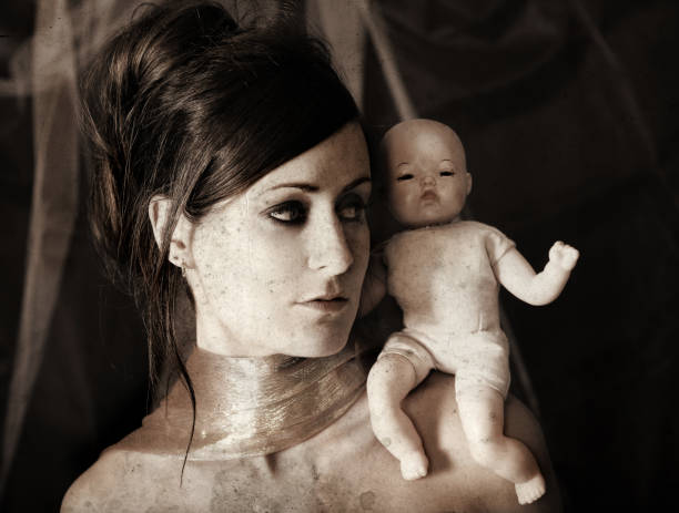 istock Woman with a doll 108126175