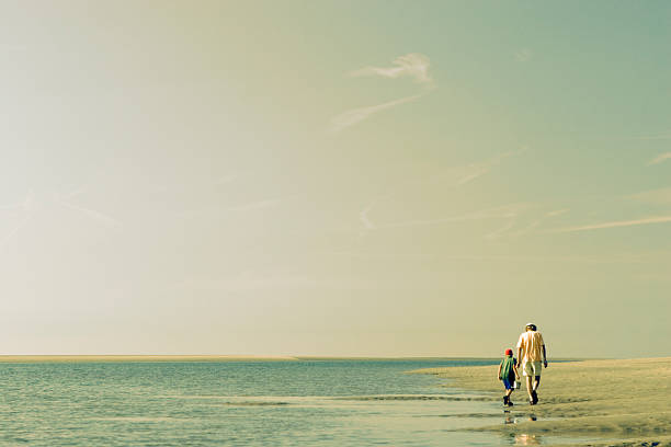 Father & Son Beach Scene  mid distance stock pictures, royalty-free photos & images