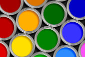 Open multi-colored paint tins from above