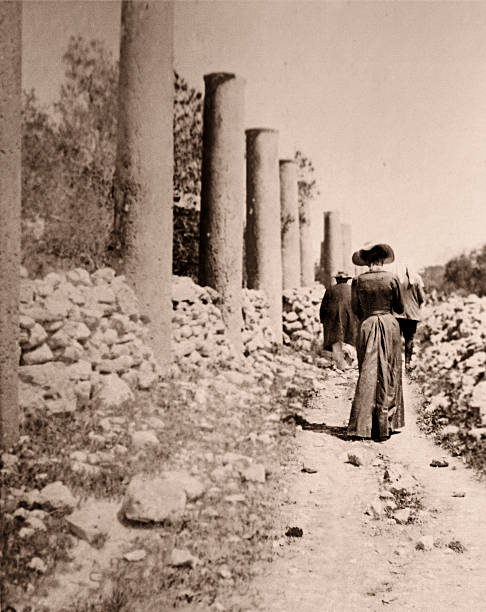 istock Victorian Woman Walking Down Path Way, Sepia Toned 108126488
