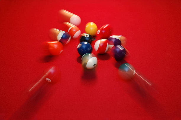 Motion Blur of Pool Balls Scattering on Red Table  pool ball stock pictures, royalty-free photos & images