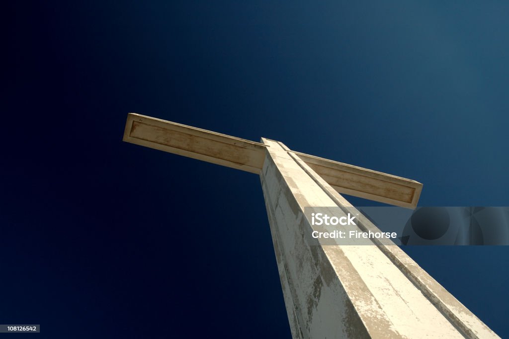 Looking Up at White Cross Against Blue Sky  Blue Stock Photo