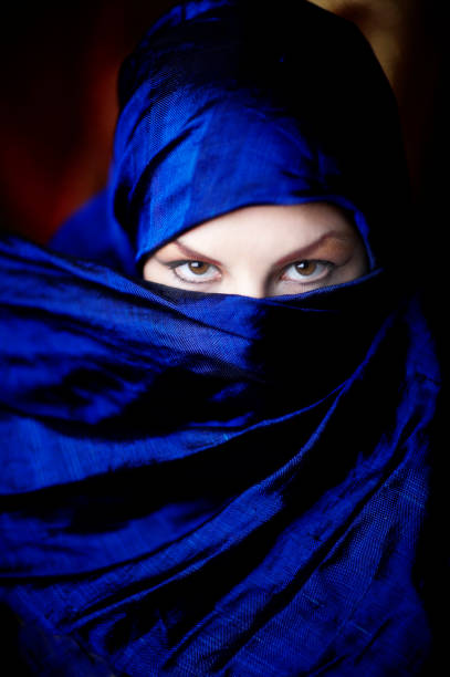 istock Young Woman's Face Covered in Scarf With Eyes Showing 108126628