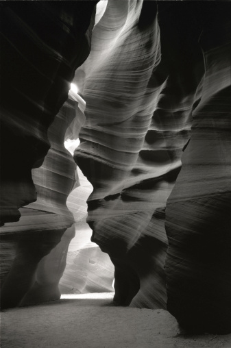 A vertical greyscale shot of beautiful cliffs in Antelope Canyon, USA