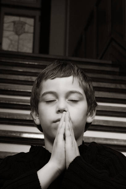 istock Little Boy Praying, Black and White 108126692