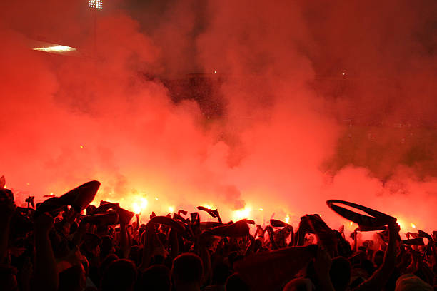 istock Crowd of People Celebrating with Smoke and Lights 108126714