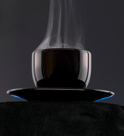 Black Coffee Cup with Steam. Vetta image, vertical shot.