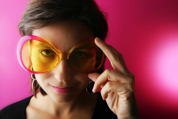 Happy woman holding fake lips on stick having fun. Photo and carnival funny accessories concept.
