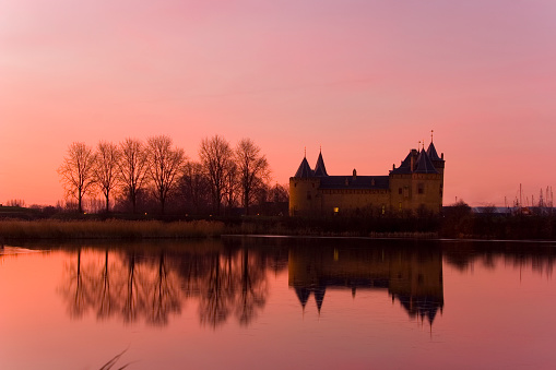 Lindlar, Germany – April 15, 2021: Castle Georghausen close to Lindlar with water reflection at evening hours, Bergisches Land, Germany