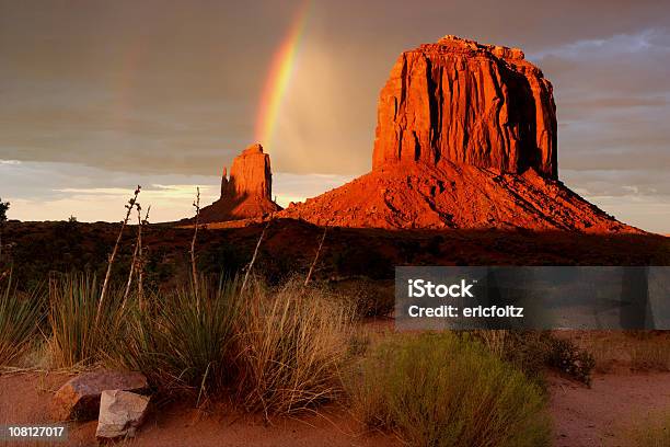Dessert Landscape Of A Rainbow Over Merrick Butte Stock Photo - Download Image Now - Monument Valley, Monument Valley Tribal Park, Rainbow