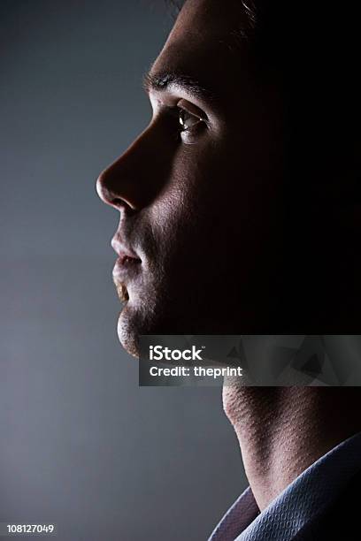 Looking Left Stock Photo - Download Image Now - Close-up, Gray Background, Human Face