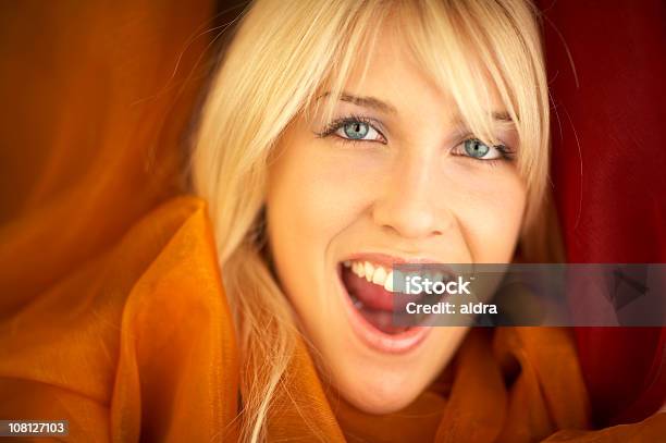 Young Woman Smiling And Wearing Orange Silk Shawl Stock Photo - Download Image Now - Adult, Adults Only, Beautiful People