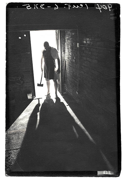 Shadow of Madman In the shadows of a madman. 

Photo is grunge with plenty of wear and tear and texture. serial killings photos stock pictures, royalty-free photos & images