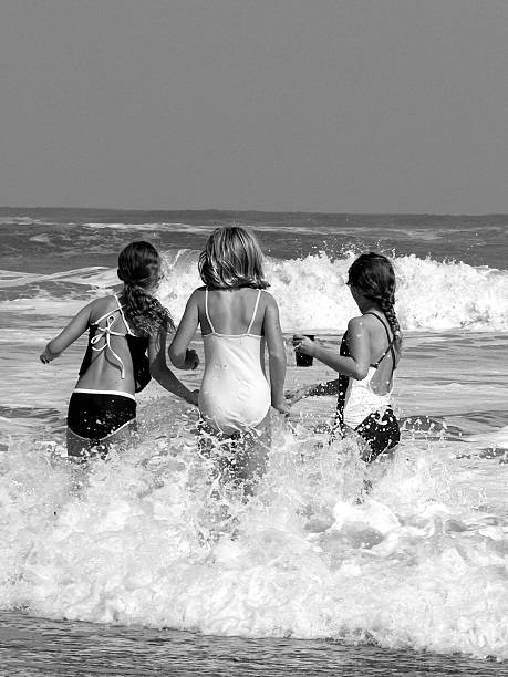 istock Three Young Women in Ocean, Black and White 108128017