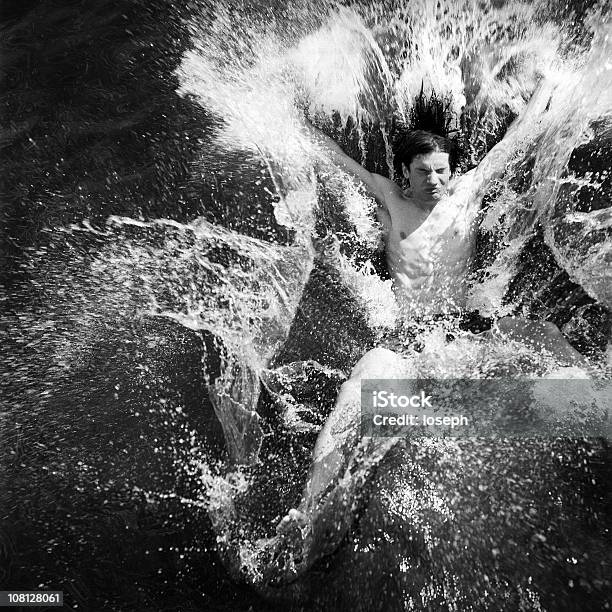 Young Man Splashing Into Ocean Stock Photo - Download Image Now - Drowning, Adult, Adults Only