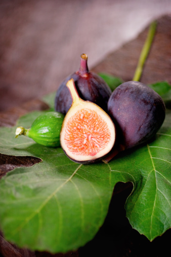 Macro photograph of ripe figs cut in half. Top view.