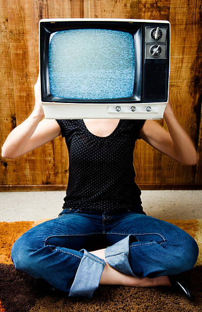 istock Woman Holding Television Near Head 108128186