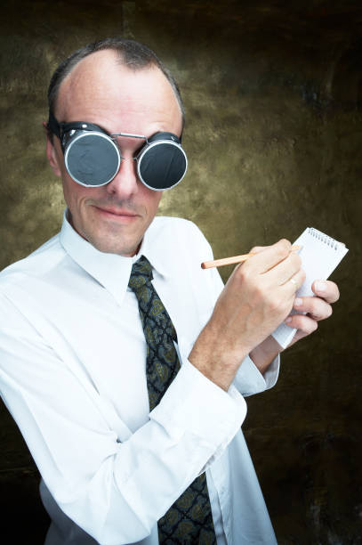 istock Businessman Wearing Goggles and Writing on Notepad 108128344