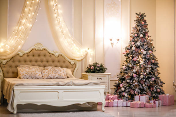 istock Bedroom with beige bed  and Christmas tree. Christmas interior. 1081283634