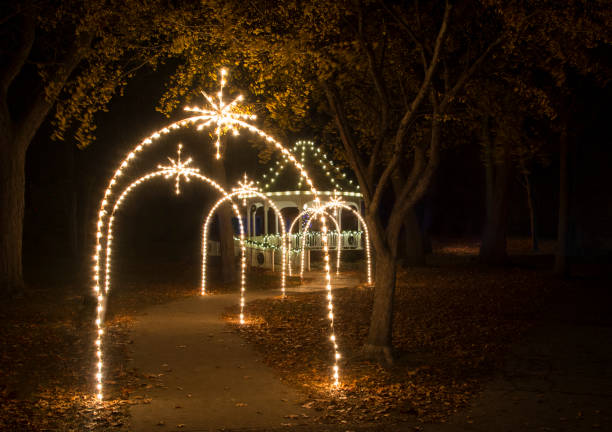 Pathway of Christmas Light Leading to a Christmas Tree in a Gazebo