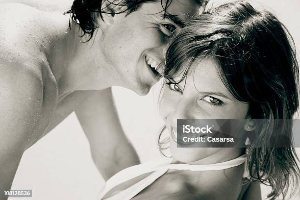 Portrait Of Young Couple At The Beach Stock Photo - Download Image Now - Adult, Adults Only, Affectionate