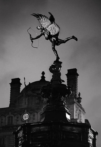Memorial fountain and statue known as 'Eros' (sometimes called 'The Angel of Christian Charity') in Piccadilly Circus, London. Black and white duotone, film grain effect. Focus on the statue, shallow DOF.\n[url=file_closeup.php?id=2111466][img]file_thumbview_approve.php?size=1&id=2111466[/img][/url] [url=file_closeup.php?id=11054647][img]file_thumbview_approve.php?size=1&id=11054647[/img][/url] [url=file_closeup.php?id=7206735][img]file_thumbview_approve.php?size=1&id=7206735[/img][/url] [url=file_closeup.php?id=15620808][img]file_thumbview_approve.php?size=1&id=15620808[/img][/url] [url=file_closeup.php?id=6284298][img]file_thumbview_approve.php?size=1&id=6284298[/img][/url] [url=file_closeup.php?id=6179526][img]file_thumbview_approve.php?size=1&id=6179526[/img][/url] [url=file_closeup.php?id=3858167][img]file_thumbview_approve.php?size=1&id=3858167[/img][/url] [url=file_closeup.php?id=15990517][img]file_thumbview_approve.php?size=1&id=15990517[/img][/url] [url=file_closeup.php?id=18919409][img]file_thumbview_approve.php?size=1&id=18919409[/img][/url]