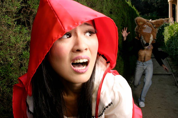 Little Red Riding Hood standing on the forest path. Slightly soft.
