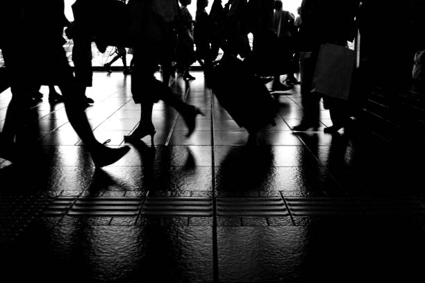 istock Silhouette of Commuters Walking Through Hallway 108128746