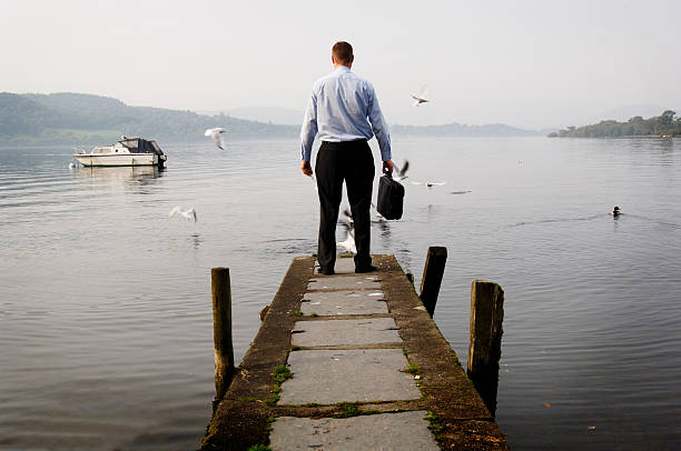 istock Businessman Standing Lake Jetty 108128788