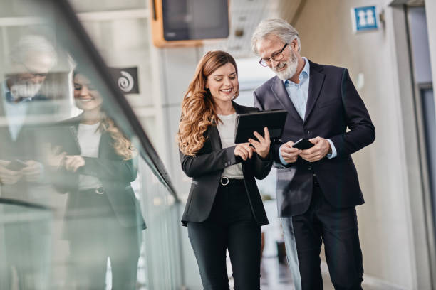 istock Co-workers discussing an important matter on a empty hallway. 

Co-workers discussing an important matter on a empty hallway. 1081292944