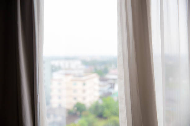 istock Defocused curtain window and stationery box with sunlight. 1081293160