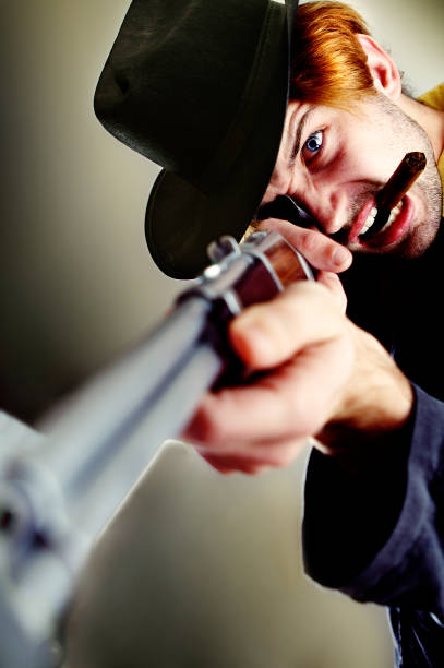 istock Cowboy Man Holding Rifle and Smoking Cigar 108129663