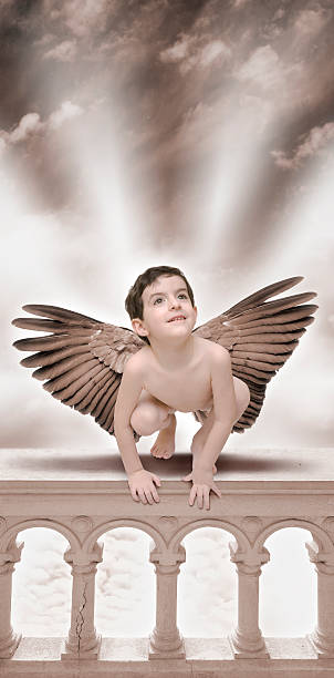 istock Little Angel boy sitting on balustrade 108129674