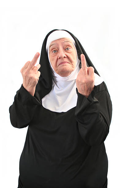 senior nonne gibt zwei nahen finger-gesten, isoliert auf weiss - nun stock-fotos und bilder