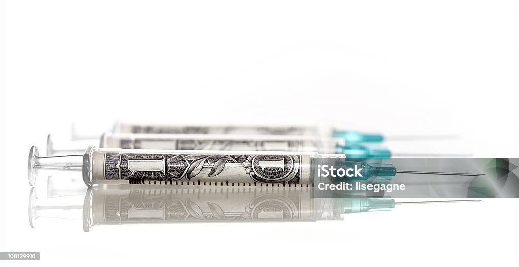 Jeringas con dólares estadounidenses - Foto de stock de Dinero libre de derechos