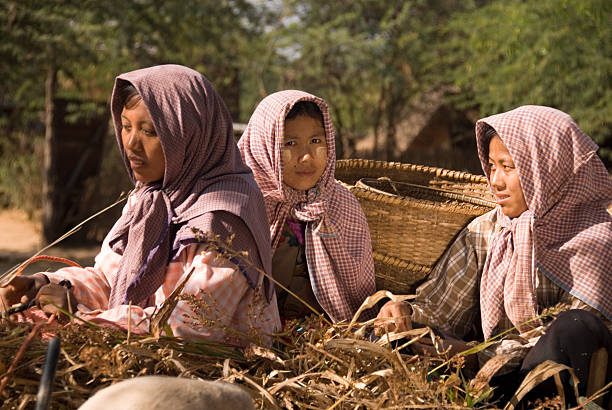 SURATTANI, THAILAND- NOV. 06, 2023: Burmese people dress in national costumes. Come out to participate in the Kathin festival during the end of Buddhist Lent for Burmese brothers and sisters in Thailand.