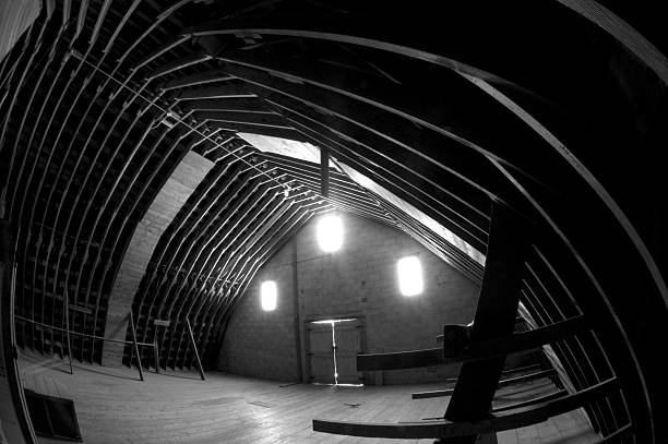 Wood beams in old factory building. Interior of abandoned fish factory with wooden ceiling.