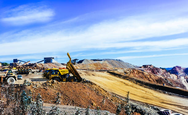 istock View of opencast mining quarry with lots of machinery at work 1081308412